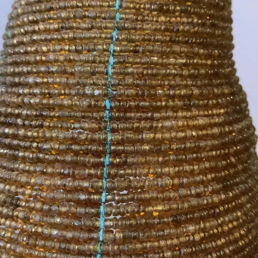Four beaded lamp shades in gold